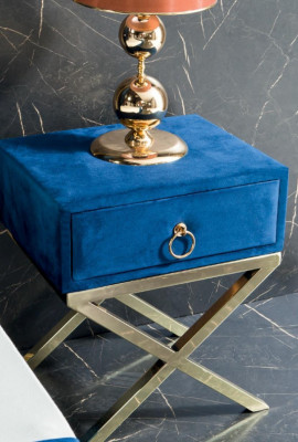 Sapphire blue designer bed with nightstands on gilded steel legs.