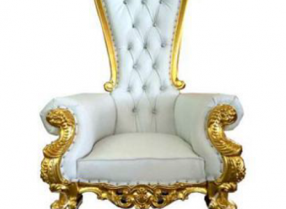 A beautiful white, ornate armchair in Baroque and Chesterfield style with Chesterfield-style elements.