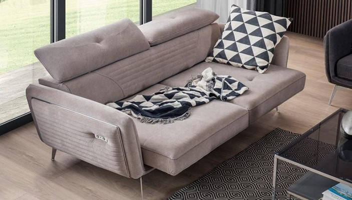 Luxurious, fashionable two-seater sofa with fabric upholstery on high legs