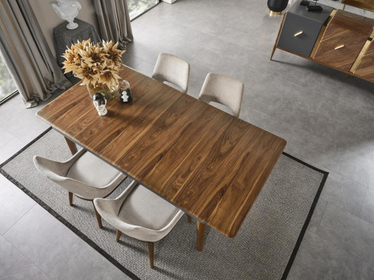 A laconic, modern chair with high wooden legs and upholstery in a pleasant, light cream color for the dining room.