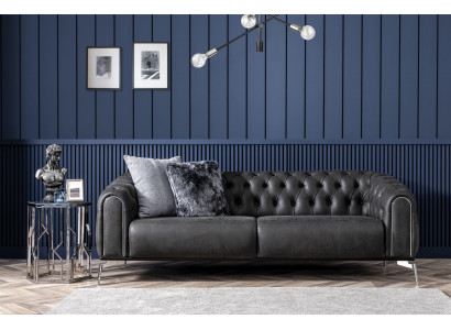 Black straight four-seater sofa in Chesterfield style for the living room.