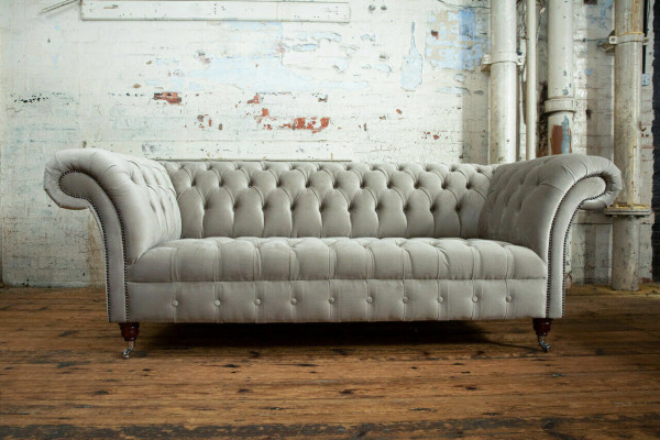 Stylish light gray Chesterfield three-seater luxury living room sofa