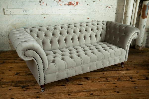 Stylish light gray Chesterfield three-seater luxury living room sofa
