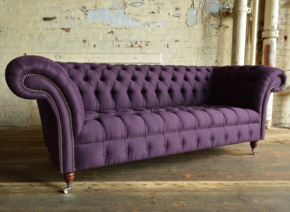 Modern purple Chesterfield three-seater living room sofa.