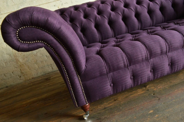 Modern purple Chesterfield three-seater living room sofa.
