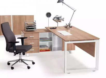 Corner table made of brown wood. Exclusive modern office furniture in the study.