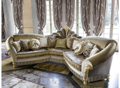 Sectional L-shaped couch upholstered in fabric, sofa design, luxury living room seating.