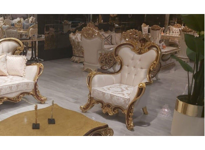 Luxurious classic wing chair in white and gold Baroque design