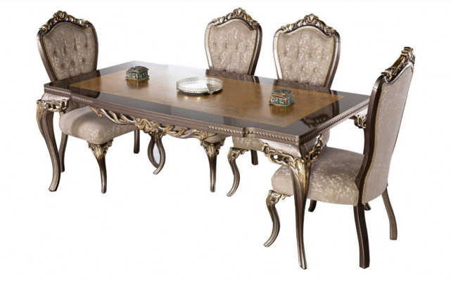 Classic dining table made of solid wood with elaborate embellishments.