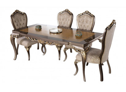 Classic dining table made of solid wood with elaborate embellishments.
