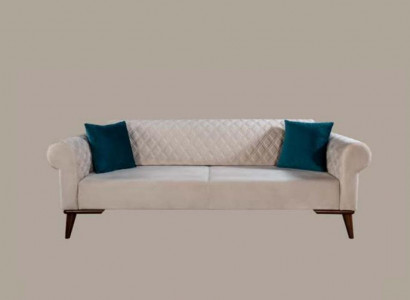 Beige three-seater couch elegant sofa seating living room velvet