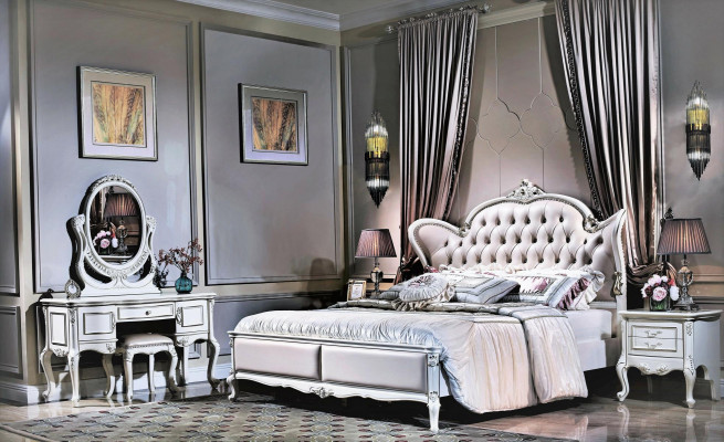 King size double bed with leather headboard in classic Chesterfield-style design