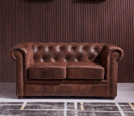 Luxurious Chesterfield sofa made of faux leather for the living room
