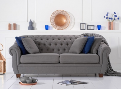 Chesterfield fabric upholstered three-seater living room couch textile design