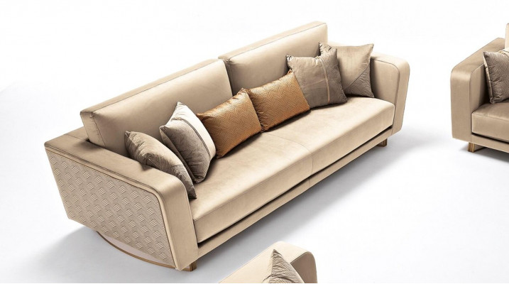 Designer three-seater upholstered sofa with modern design for the living room