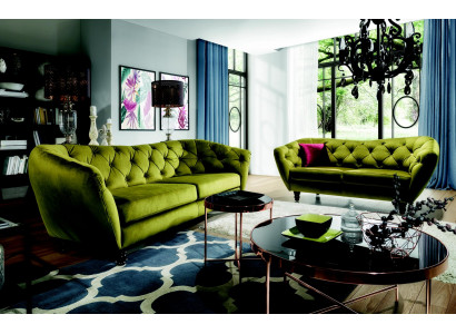 Three-seater sofa with a luxurious Chesterfield backrest in an elegant green tone