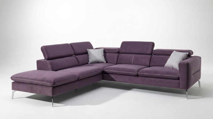 A functional, stylish corner sofa in a modern style for your home in purple luxury upholstery.