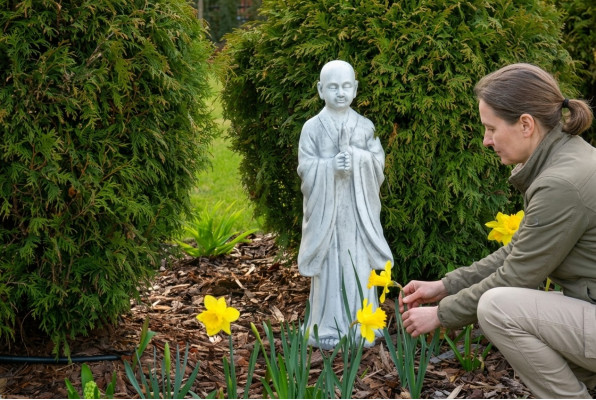 Buddha sculpture in stone look. Large decorative sculpture for garden figure.