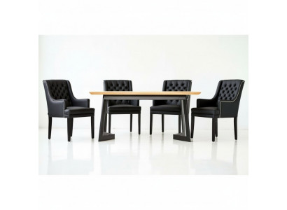 Designer dining table with 4 Chesterfield chairs seating group.