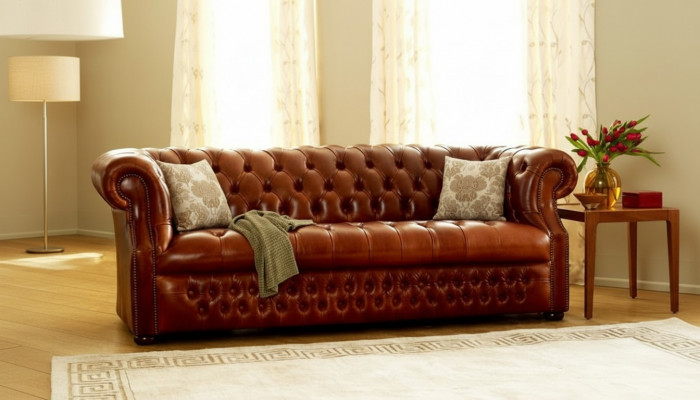 Brown Chesterfield three-seater designer sofa stylish couch