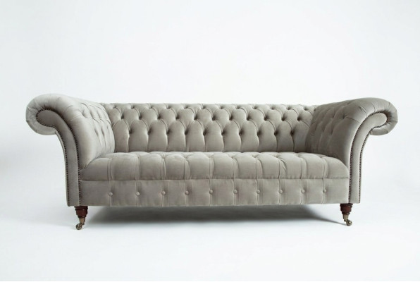 Stylish light gray Chesterfield three-seater luxury living room sofa