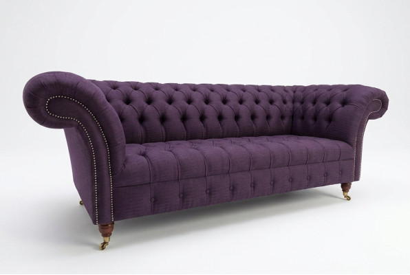 Modern purple Chesterfield three-seater living room sofa.