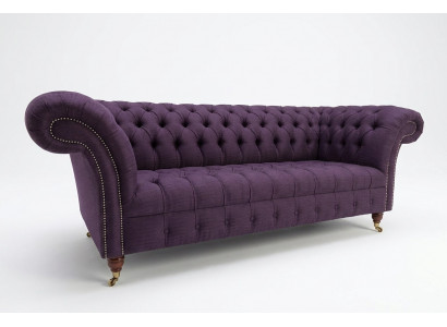 Modern purple Chesterfield three-seater living room sofa.
