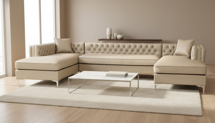 Beige sectional sofa living area couch corner suite upholstery Chesterfield furniture design.
