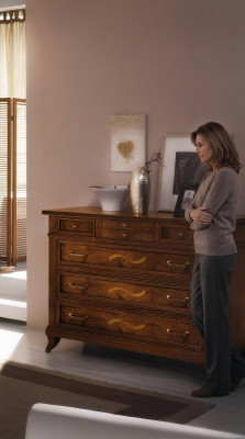 Wooden dresser in a classic style on elegant legs for living room or bedroom