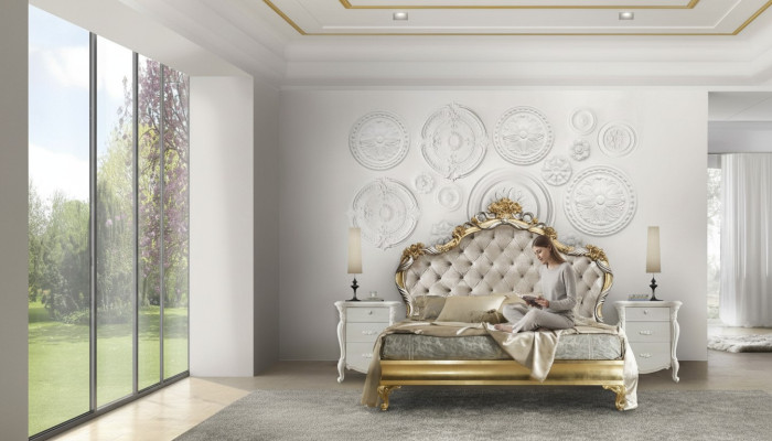 Beautiful bed in a classic style with a carved headboard.