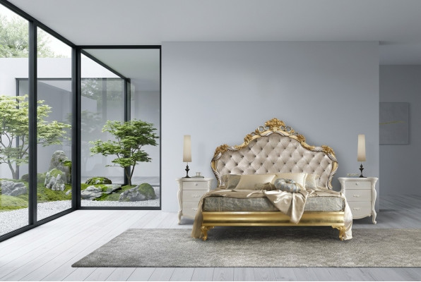 Beautiful bed in a classic style with a carved headboard.
