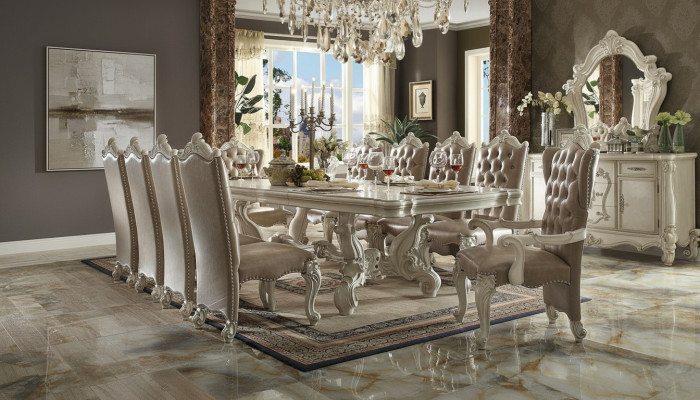 Classic dining room set in antique white. Large dining table with Chesterfield chairs.