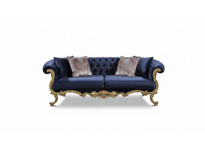 Chesterfield three-seater sofa in luxurious blue color for the living room