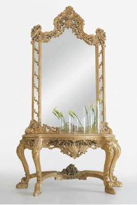 Luxurious carved console table and mirror in an elegant frame