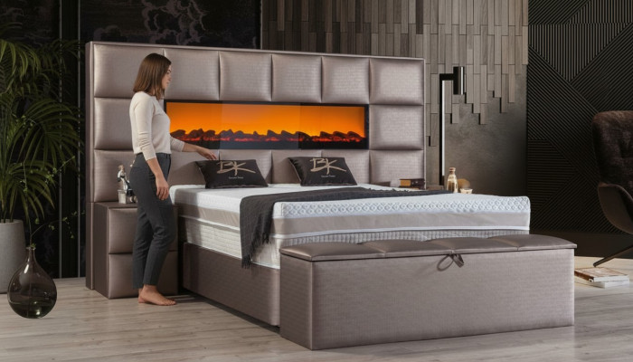 Elegant contemporary double bed with spacious upholstered headboard.