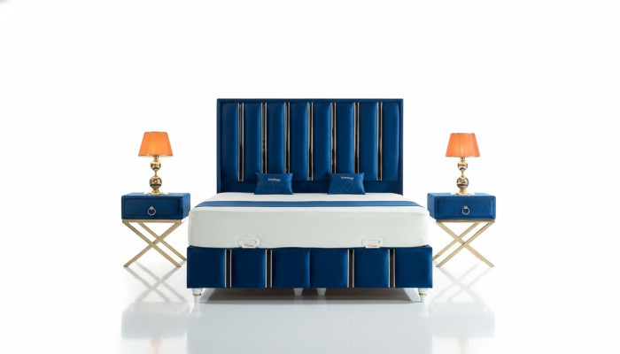 Sapphire blue designer bed with nightstands on gilded steel legs.