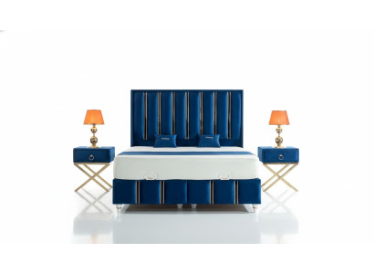 Sapphire blue designer bed with nightstands on gilded steel legs.