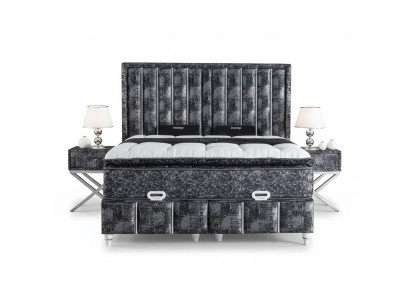Black bed with mattress and two nightstands in the bedroom furniture set