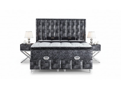Black bed with mattress and two nightstands in the bedroom furniture set