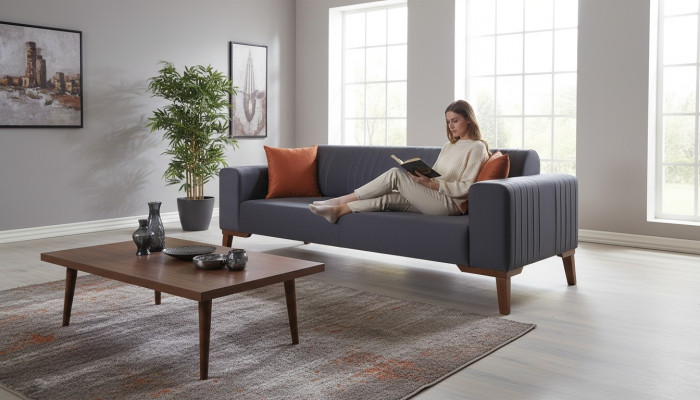 Gray three-seater couch elegant sofa seating furniture living room velvet.