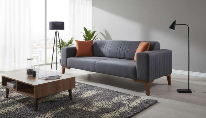 Gray three-seater couch elegant sofa seating furniture living room velvet.