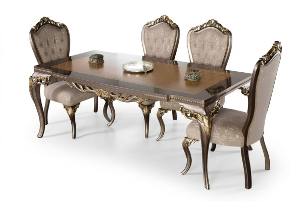 Classic dining table made of solid wood with elaborate embellishments.