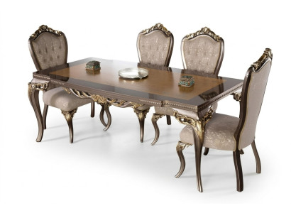Classic dining table made of solid wood with elaborate embellishments.