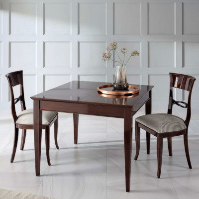 Elegant dining table with chairs in dark brown color with a glossy finish