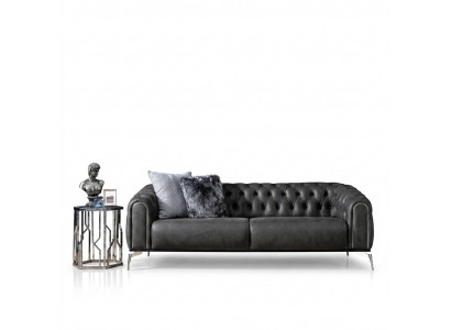 Black straight four-seater sofa in Chesterfield style for the living room.