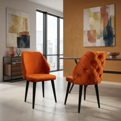 Padded orange Chesterfield wooden chair on black legs the dining room