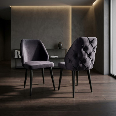 Padded gray wood chair, Chesterfield style, on black legs for dining room.