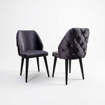 Padded gray wood chair, Chesterfield style, on black legs for dining room.