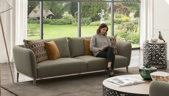 Olive green three-seater modern living room couch seating furniture sofa.