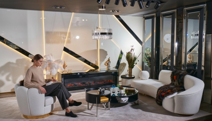 Luxurious white living room set with 3-seater, armchair, round coffee table.